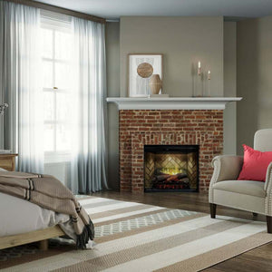 Dimplex Revillusion 30-inch electric fireplace with Herringbone Brick interior panel built into a custom bedroom wall