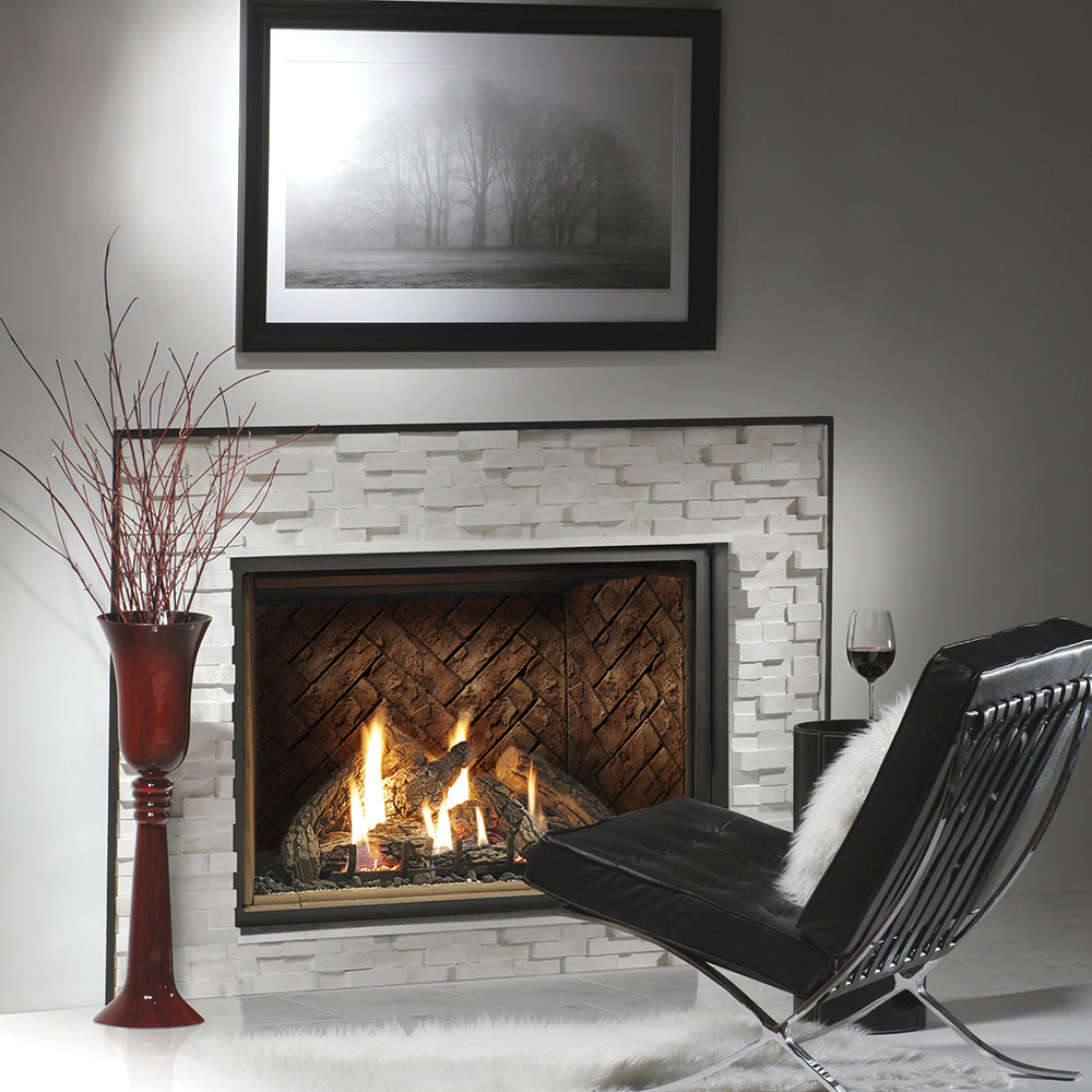 Kingsman direct vent gas fireplace professionally installed in  a home with custom stone surround