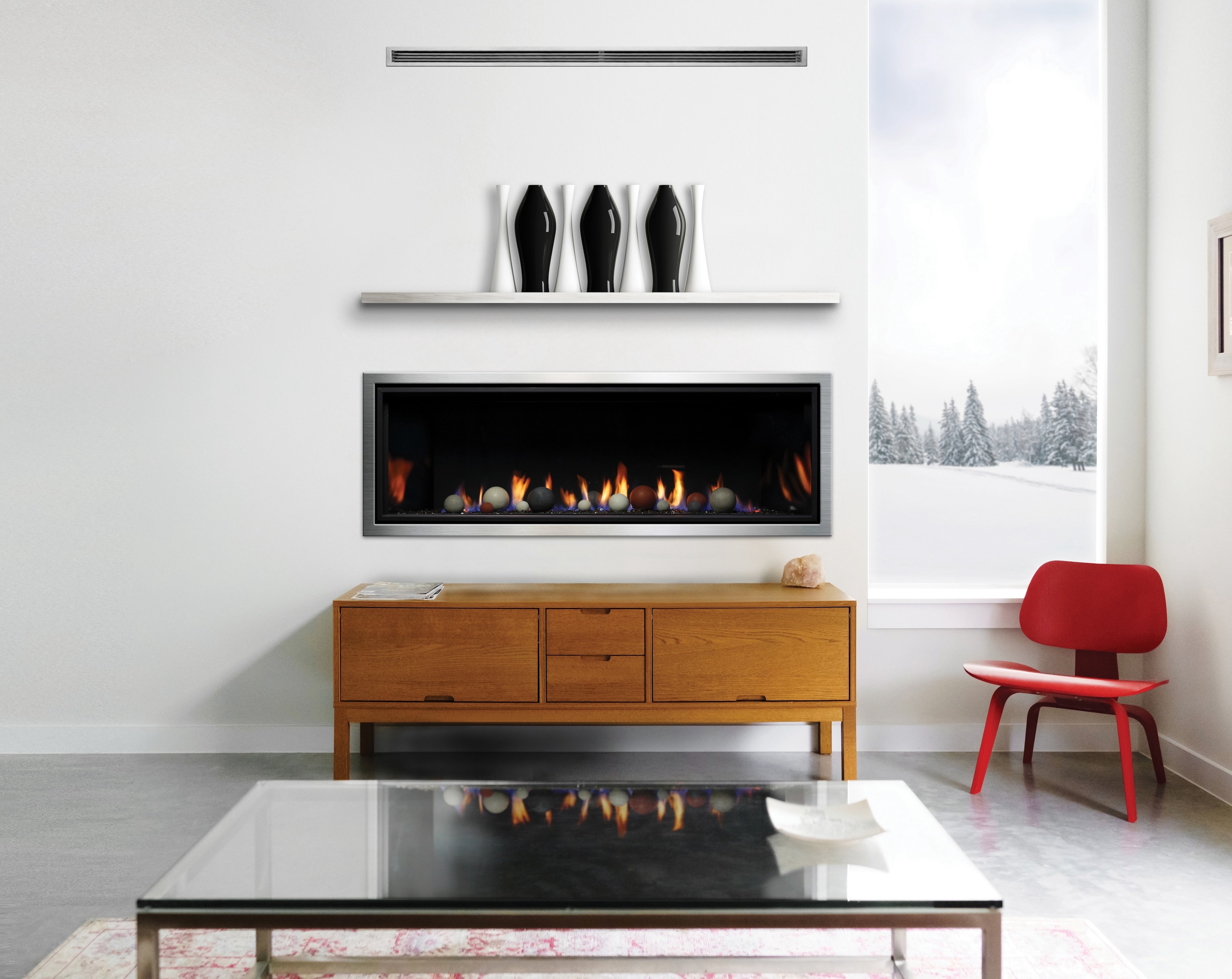 Kingsman ZCVRB60 60-inch linear direct vent gas fireplace with cannonball media in a modern great room