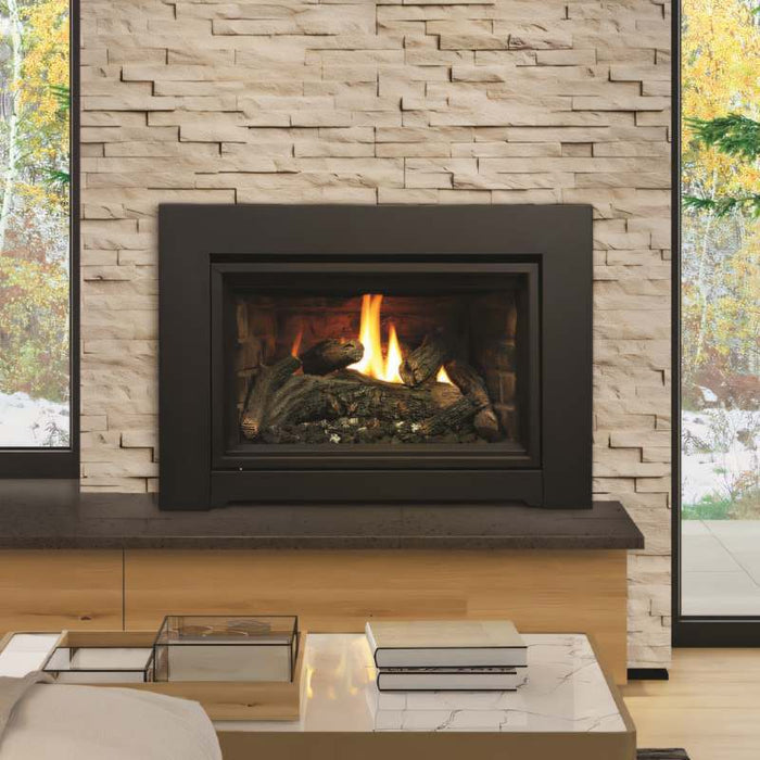 Kingsman IDV24 gas fireplace insert shown face on with oak log set and traditional brick liner in a masonry opening
