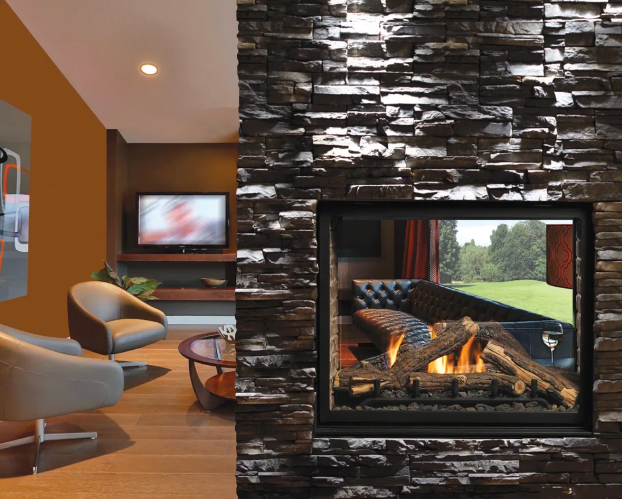 Kingsman Clean View 43 MCVST42 see-through gas fireplace installed in a living room partition wall with stone surround and oak log set