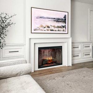 Dimplex Revillusion 24 inch built-in electric fireplace with weathered concrete panel framed into a living room wall