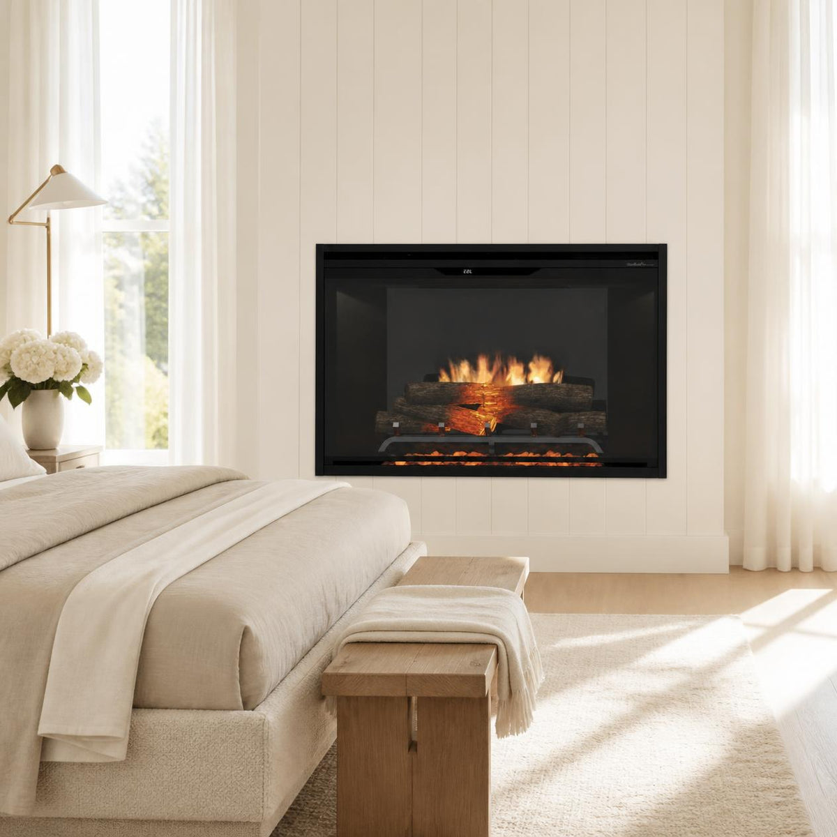 Dimplex Revillusion 36-inch built-in electric fireplace with black interior in a bright luxury primary bedroom