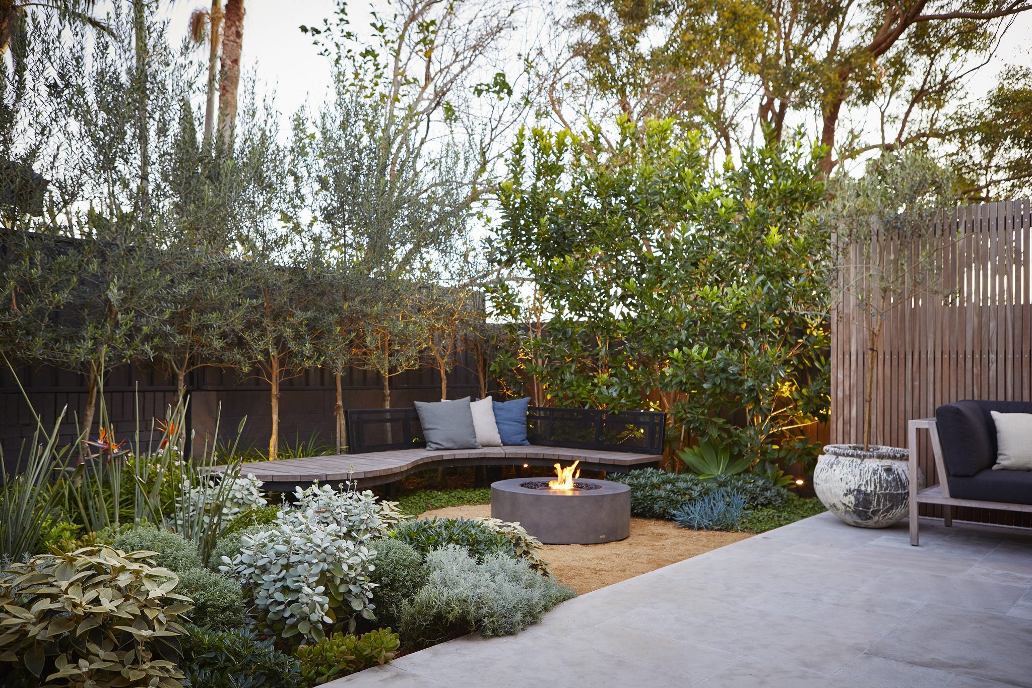 EcoSmart Fire Ark 40 in a landscaped garden courtyard